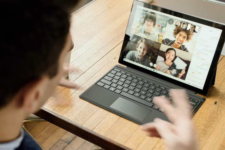 Video Conferencing Etiquette man on video call in front of laptop