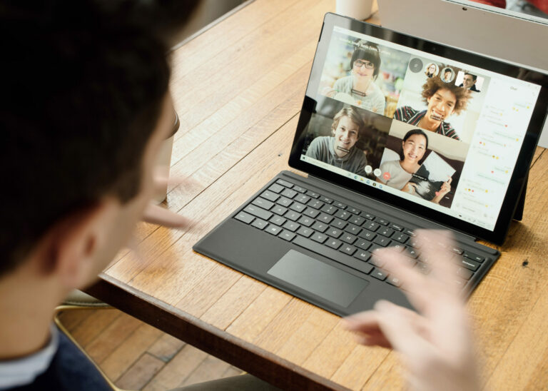 Video Conferencing Etiquette man on video call in front of laptop