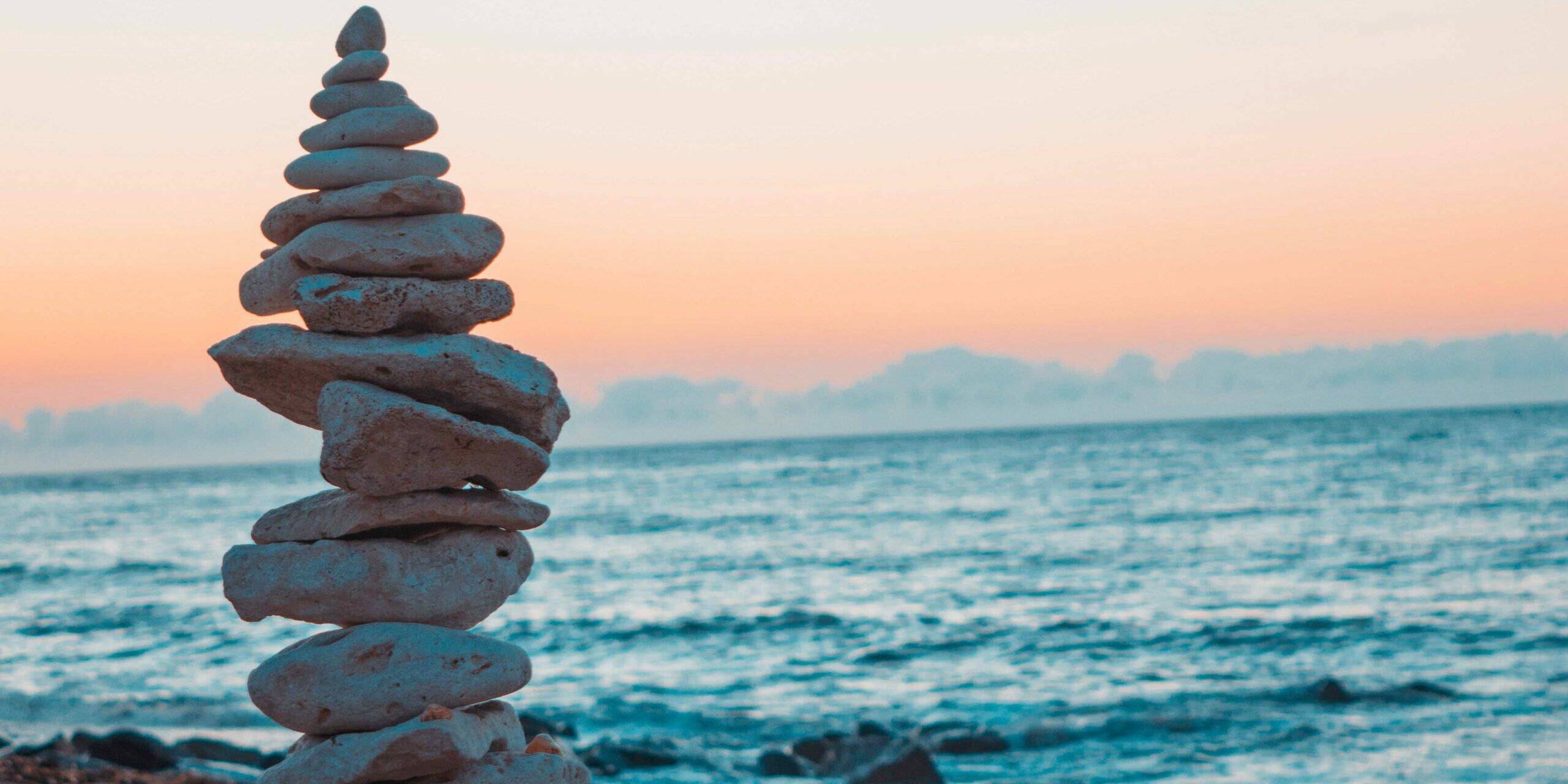 rocks and ocean workplace mental health peaceful