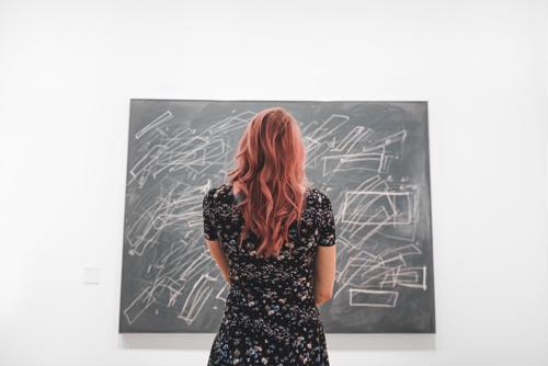 Woman looking at art.