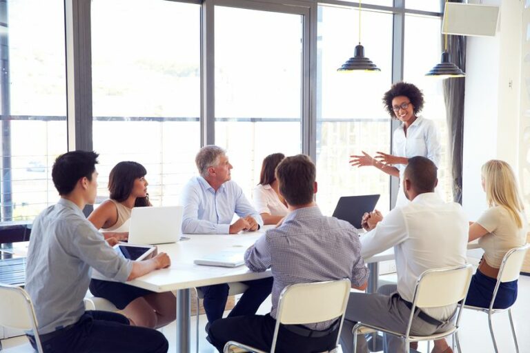 A women discussing ideas with Corporate Communications Recruiters