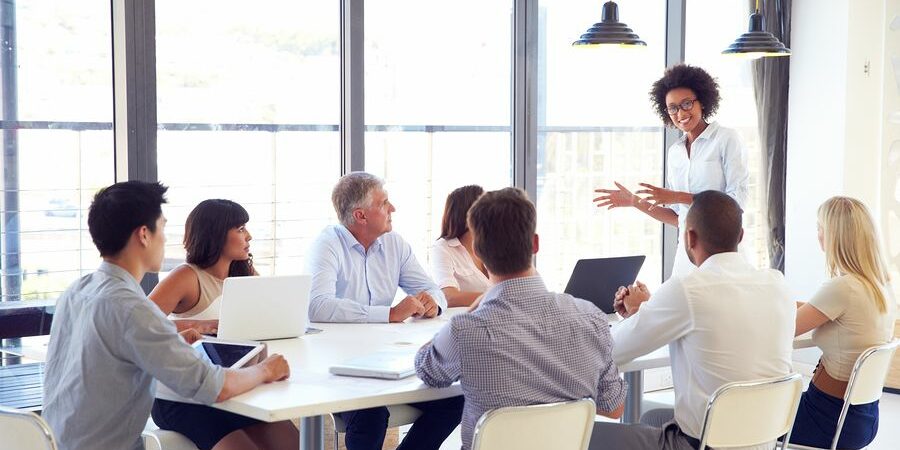 A women discussing ideas with Corporate Communications Recruiters