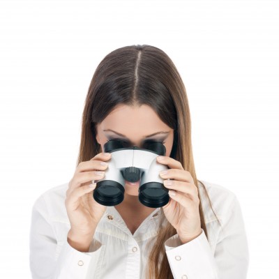 woman looking through binoculars