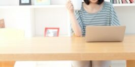 woman working at her desk in a bright office