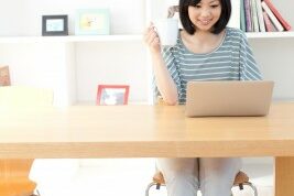 woman working at her desk in a bright office