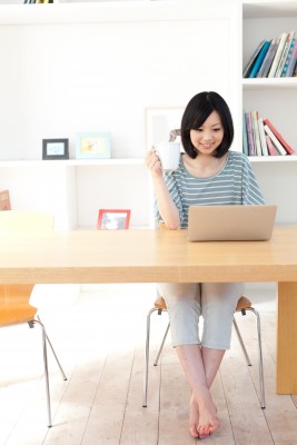 woman working at her desk in a bright office