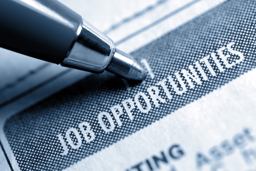 pen pointing to job opportunities in a paper