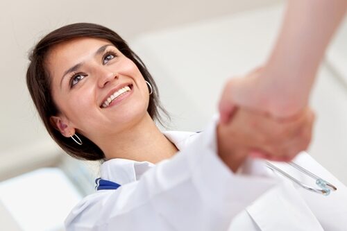 Doctor shaking hands with someone