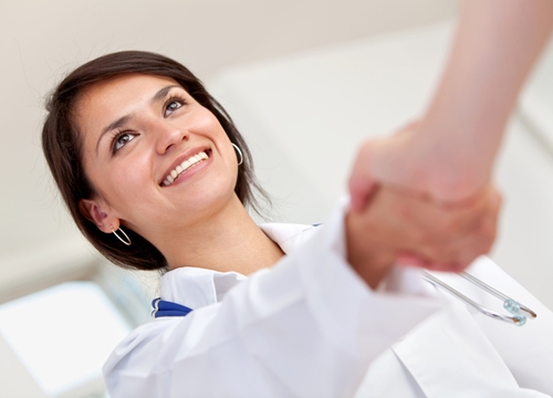 Doctor shaking hands with someone