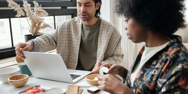 couple works at desk remote work after covid-19