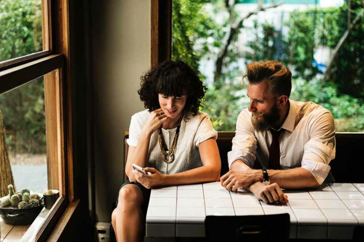 friends-having-conversation-in-coffee-shop friends-having-conversation-in-coffee-shop