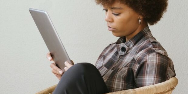 woman on furlough on tablet