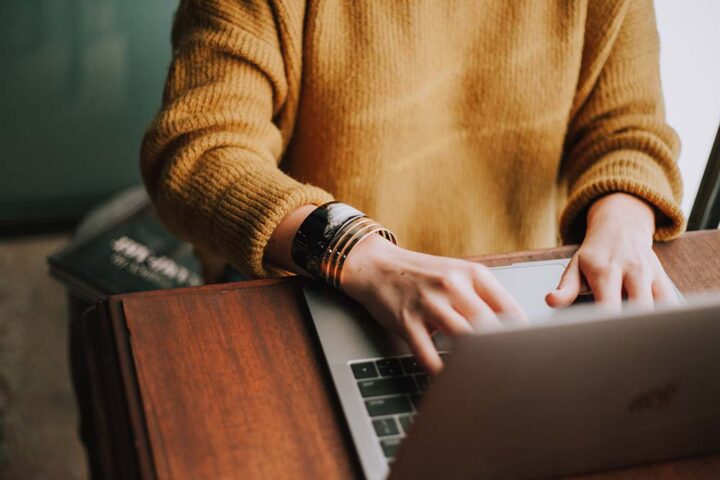 woman-on-computer-creating-resume Woman on computer creating resume using creative resume tips