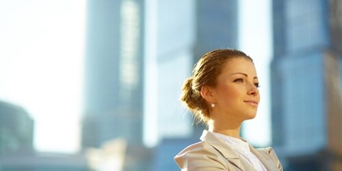 woman smiling in front of window