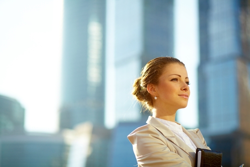 woman smiling in front of window