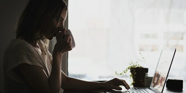 candidate searching for jobs sipping coffee mug