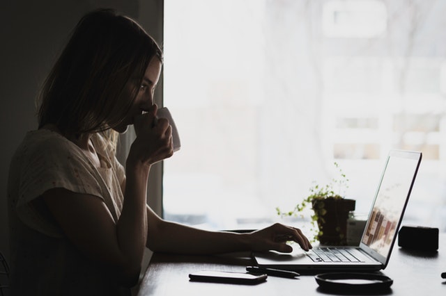 candidate searching for jobs sipping coffee mug