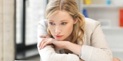 woman sad at her desk