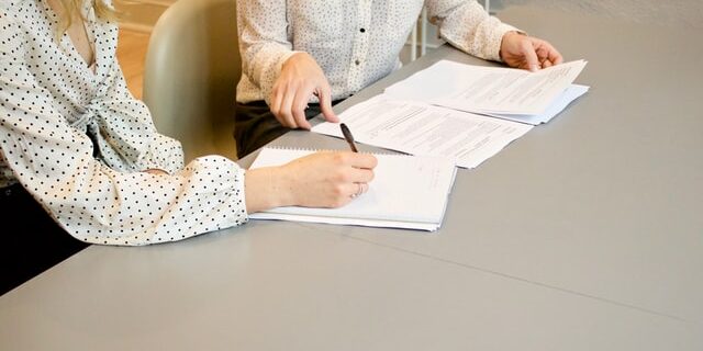 marketing recruiter and candidate meeting at table