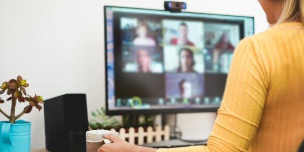 woman on computer for virtual team bonding coffee date