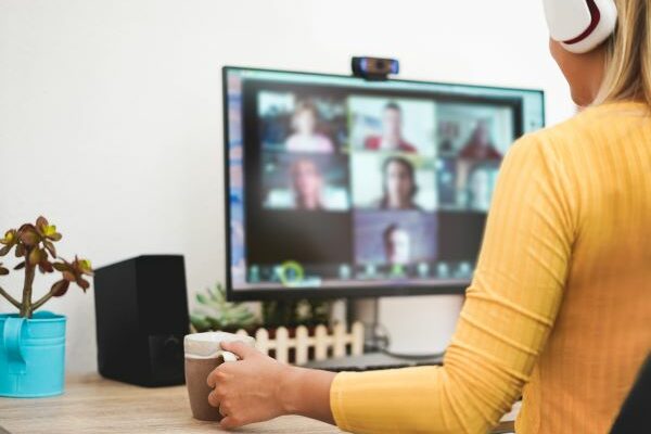 woman on computer for virtual team bonding coffee date