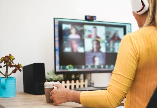 woman on computer for virtual team bonding coffee date