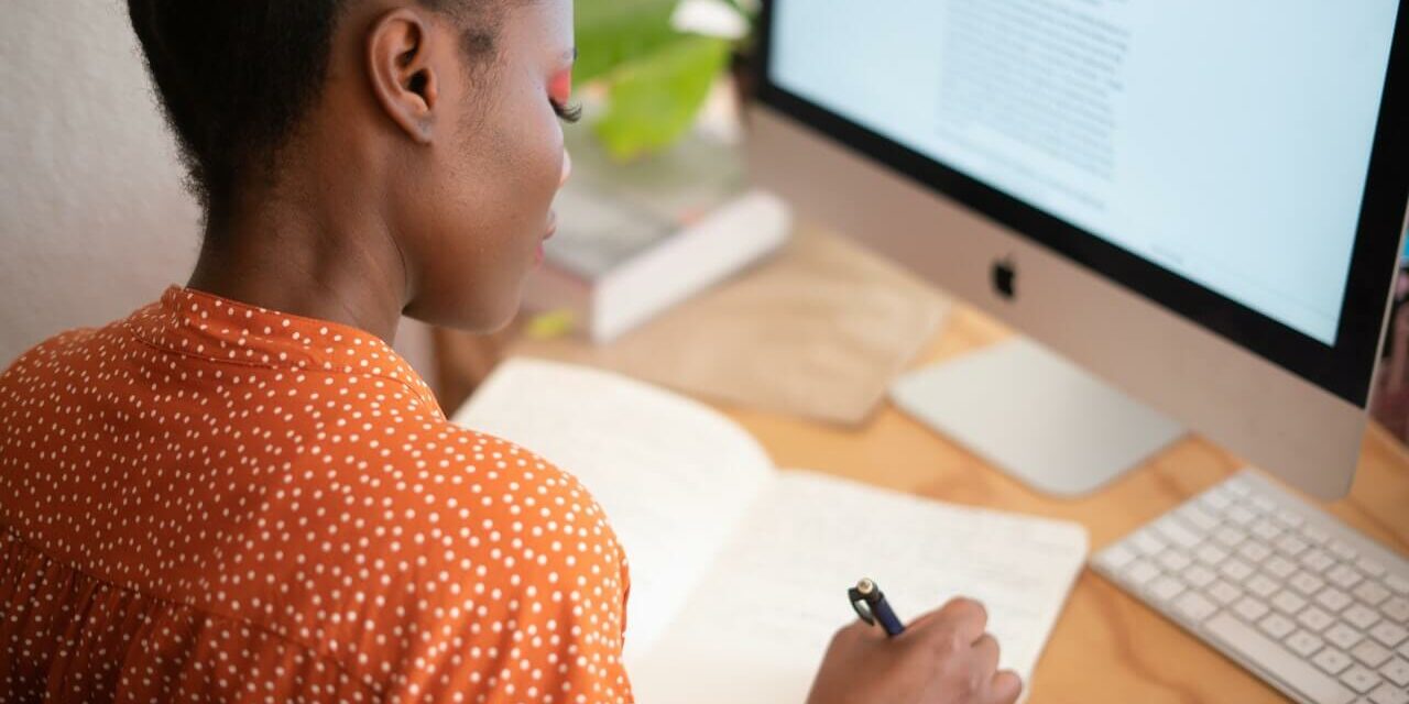 woman on computer career housekeeping