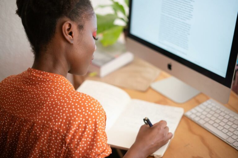 woman on computer career housekeeping