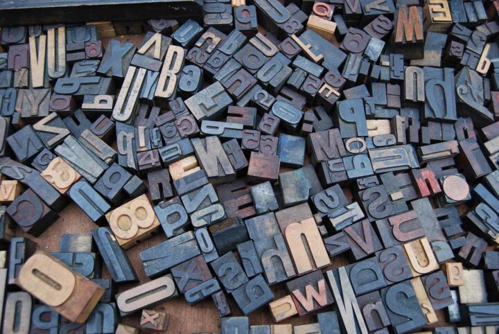 copwriting-trends-2021-letters Wooden blocks with letters and numbers all laying in a jumble on the floor.