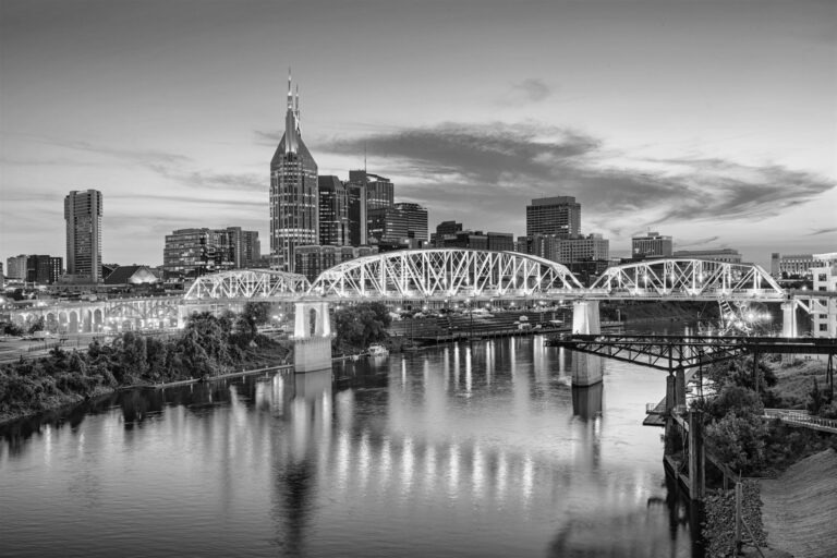 Black and white photo of Nashville, Tennessee, USA downtown skyline on the Cumberland River.