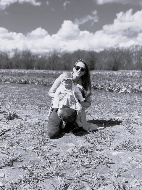 Profiles Senior Account Manager April Walton holding baby girl