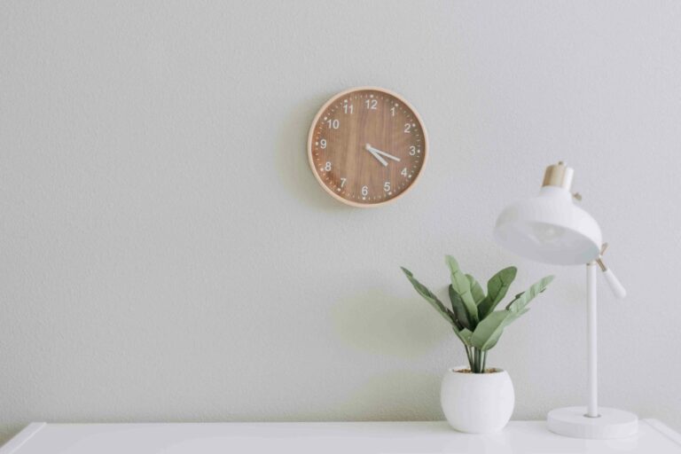 desk with clock and lamp four day work week