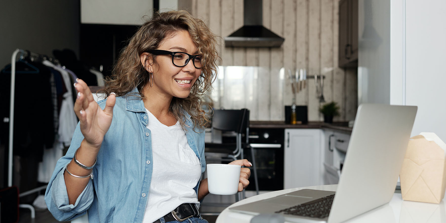 woman with coffee on computer starting new job