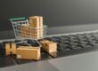 CMO in Consumer Packaged Goods - mini shopping cart with boxes on laptop