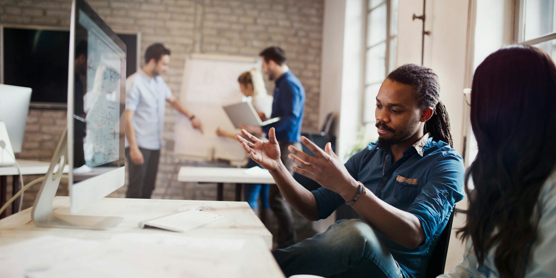 Top Digital In-Demand Skills Driving Hiring Decisions in 2026 man and woman working together at desk in a digital in-demand skills-based job