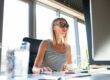 woman working as a marketing operations specialist orchestrating AI technology along with marketing operations technology
